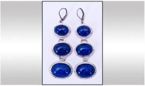 Lapis Lazuri Pair of Triple Drop Earrings; each earring comprising three graduated oval lapis