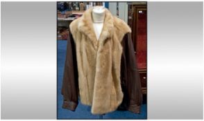 Mink Ladies Jacket with brown Leather Batwing Sleeves, fully lined. Label inside reads "Furs by