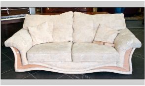 Three Seater Settee, cream upholstered fabric with beech effect feet.