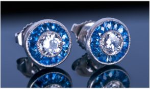 Art Deco Style Diamond And Sapphire Earrings, Each Set With A Central Round Brilliant Cut Diamond,
