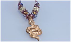 Crystal Snake and Purple Faceted Glass Pendant Necklace and Earrings, the snake pendant, with the