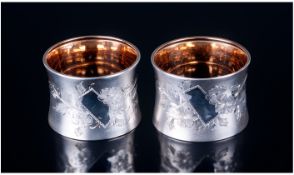 A Fine Quality Pair of Silver Napkin Rings. The Frosted Exterior with Vacant Floral Cartouche and