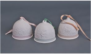 Three Lladro 'Collector Society' Bells. 3.5 inches in height with pink, green and orange trim.