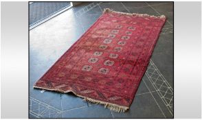 Afghan Tekke Carpet. Predominantly red in colour. 40 inches wide.