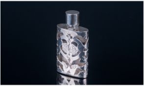 A Silver and Glass Scent Bottle With Silver Screw Cap Silver Base and Stylised Floral Patterned