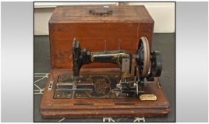 German Sewing Machine in a walnut inlaid case.