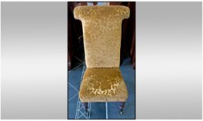 Victorian Simulated Rosewood Nursing Chair on turned legs and brass castors. With a tall gold