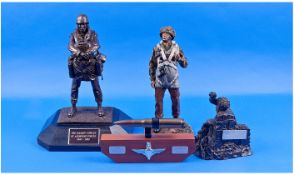 Military Interest, Four Resin Figures. 1, bronze effect resin figure of a soldier carrying bags,