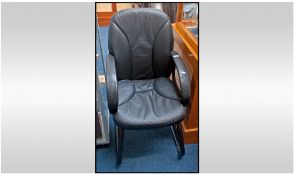 Modern Office Chair, faux leather cushion, seat and back rest, plastic moulded arms. Raised on a