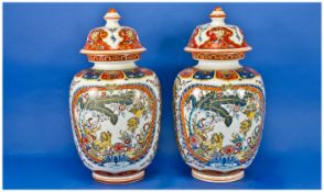Chinese Pair Of Mid 20th Century Decorative Lidded Vases, with character marks to base. Each