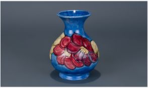 Moorcroft Vase ' Clematis ' Design on Light Blue Ground. Label to Underside Reads - Potters to The