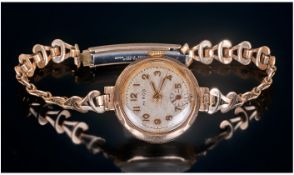 Hirco - 9ct Gold Cased Manuel Wind Ladies Wrist Watch, with Integral 9ct Gold Bracelet. c.1930's.