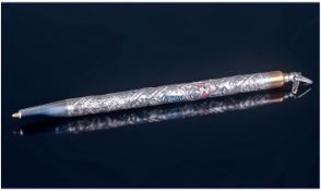 A Silver Barrelled Pen Decorated In Relief with Traditional Patterns and Enamel Highlights by The