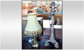 Two Modern Lamps, one with brass stem and yellow shade, 20 inches in height. Another candle stick
