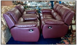 Red Leather Reclining Three Piece Suite comprising three seater sofe and two single chairs.