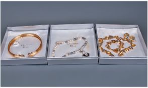 Christian Dior, Three Boxed Sets Of Jewellery, Comprising A Paste Set Yellow Metal Choker, Simulated