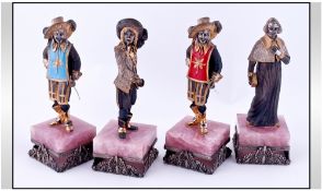 The Four Musketeers. Set of Four Metal Figures on decorated square plinths.