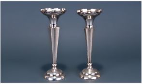 A Good Pair of Silver Posey Holders/Vases, with tapered faceted stems. Raised on circular stepped