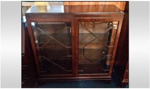 Mahogany Display Unit, glazed astral doors, with two internal glass shelves. Raised on short bracket