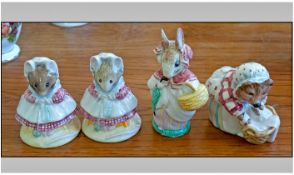 Collection Of Four Beswick Beatrix Potter Figures. Comprising; 1, Mrs Rabbit, height 4 inches. 2,