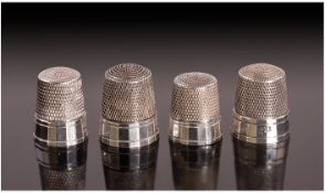 A Set of Four American Silver Thimbles. Each with a multi faceted rim, Unmarked but test silver.