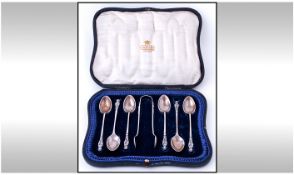 A Silver Set of Six Apostle Teaspoons and Matching Sugar Tongs (7) pieces in total. In original box.