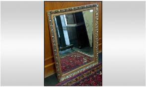 One Mirror, with brass coloured frame with embossed decoration. 23.25 x 31.25 inches.