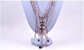 Ladies Silver and Rose Quartz Long Triple Strand Necklace with a silver and amethyst long clasp