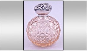 Edwardian Silver Collared And Topped Cut Glass Perfume Bottle, complete with inner stopper. Hallmark