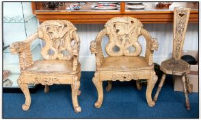 Two Oriental Style Carved Dragon Armchairs, the back rests and arms supports moulded in the form