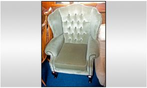 Modern Upholstered Wing Chair, buttoned back, removable cushioned seat. Short cabriole legs in the