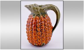 A Majolica Pineapple Shaped Jug. Circa 1900-1910. Unmarked. 8.25 inches in height. Excellent