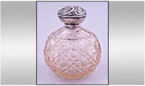 Edwardian Globular Shaped Silver Collared And Topped Cut Glass Perfume Bottle. Complete with inner