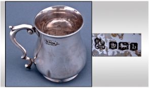 A Silver Shaped Tankard of Plain Form, with Scroll Handle. Hallmark Sheffield 1919. Stands 4.75