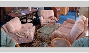 Three Piece Suite Comprising three seater sofa and two single armchairs. Pink striped upholstery.