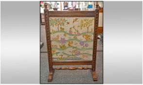 Oak Framed Firescreen. c 1920/1930's with tapestry insert. 33 inches high, 22 inches wide.