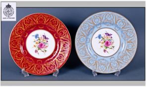Two Royal Worcester Cabinet Plates, 10.65 inches in diameter. One burgundy, one pale blue with