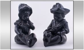 Pair of Black Piano Dolls, 11 inches in height.