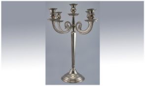 A Good Quality Aluminium And Plated Four Branch Candelabra, in the regency style. Raised on a