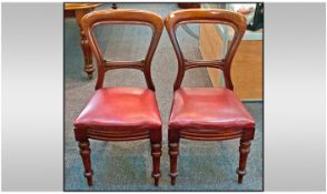 Pair of Late Victorian Mahogany Spoon Back Chairs with turned legs and over stuffed red