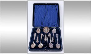 A Fine Silver Eight Piece Teaset comprises six ornate teaspoons , pair of sugar tongs, 1 carry