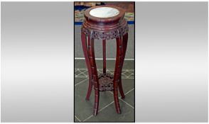 Chinese Carved Cherry wood Urn Stand on Cabriole shaped legs with a white marble top.