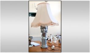 Large Lamp With A Silver Coloured Base In The Form Of A Ladies Head. Peach coloured shade with