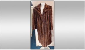 Knee Length Mink Coat. Slit pockets, fully lined. Size approx 10-12.