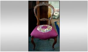 Victorian Walnut Carved Cabriole Leg Chair with Carved Back with an embroidered red seat.