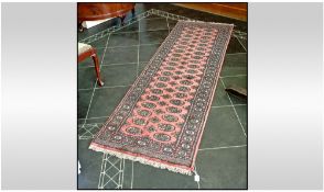 Early 20th Century Silk Woven Rug. Black and green paisley style pattern on dark salmon ground. With