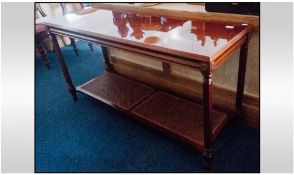 Contemporary Walnut Side Table. With reeded square legs, with a ratan under shelf.