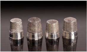 A Set of Four American Silver Thimbles. Each with a multi faceted rim, Unmarked but test silver.