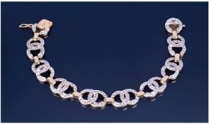 18ct Gold Diamond Bracelet. Channel design, each link with Interlocking ``C`` design. Set with