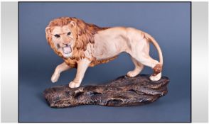Beswick Lion On A Rock Figure. Model number 2554. Designer Graham Tongue. Issued 1975-1984.